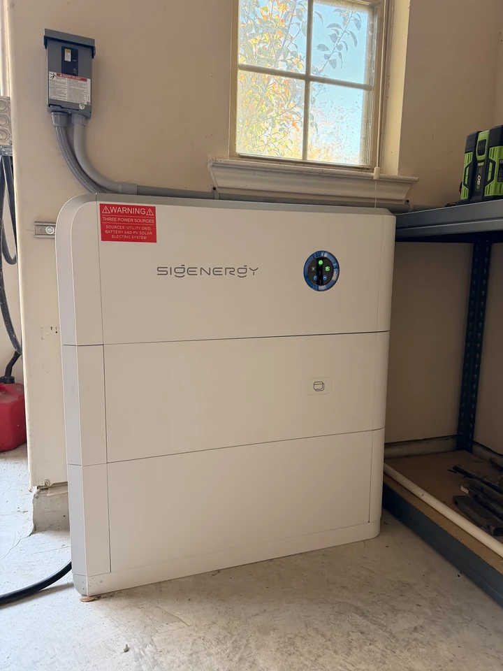Real Houston customer install: Eos battery cleanly wall mounted in a residential garage next to a window, no excavation, no outdoor equipment